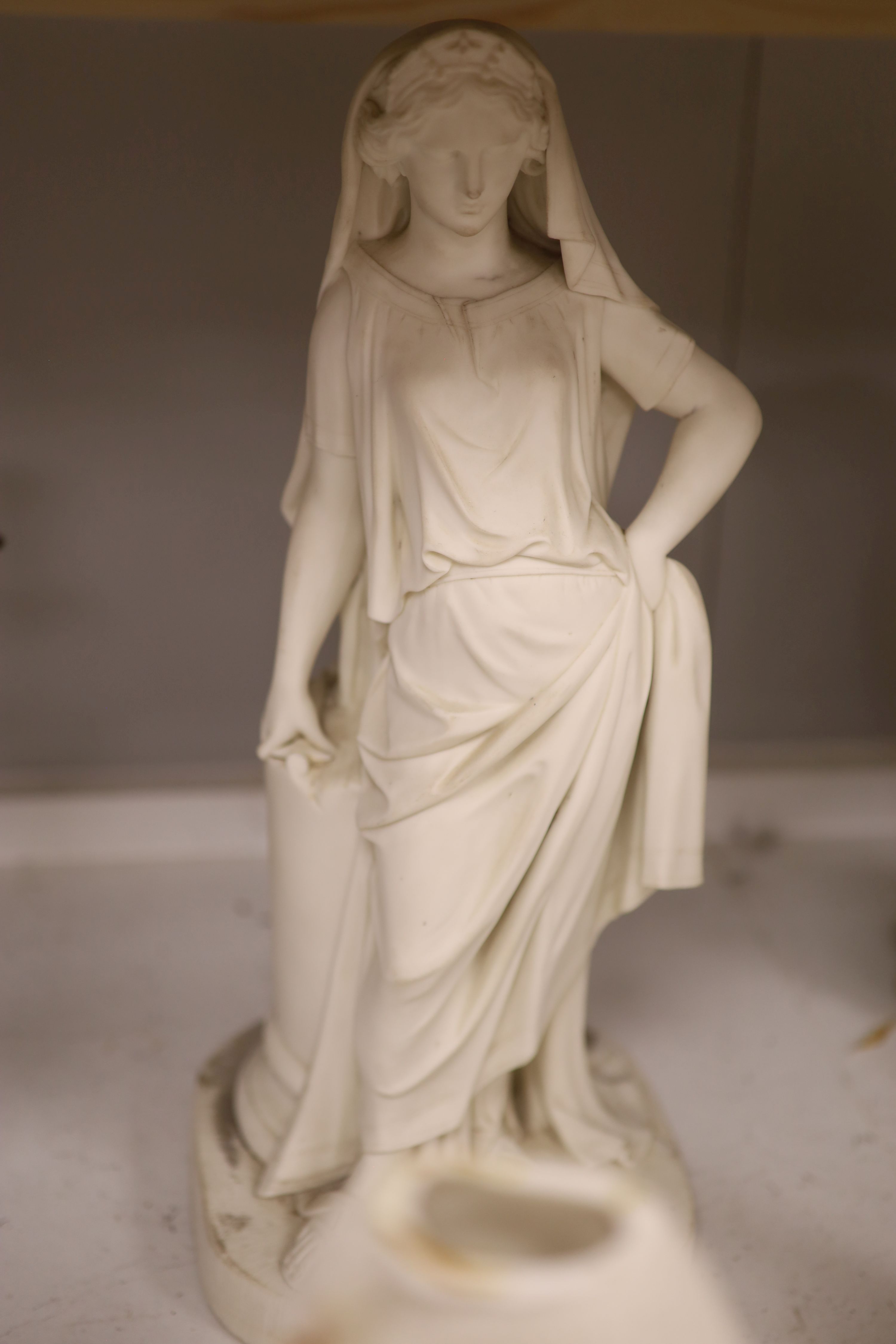 Two Minton parian figures of classical maidens and a similar Worcester figure, tallest 43cm (a.f.)